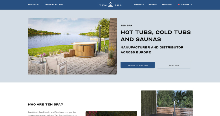 Outdoor hot tub on a stone patio beside a lake, with white chairs and greenery in the foreground (spa promo image)